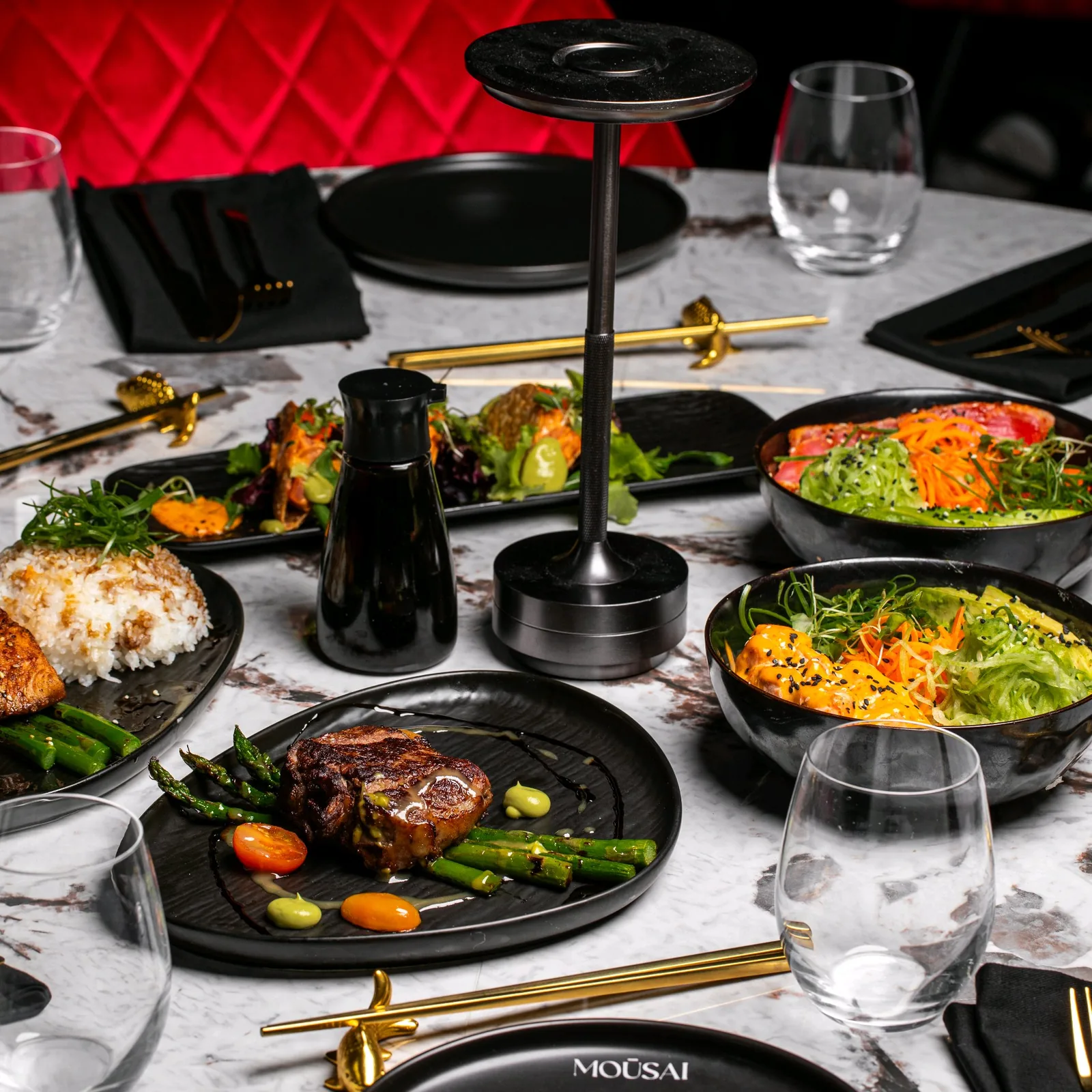 A spread of Mousai dishes on the restaurant table