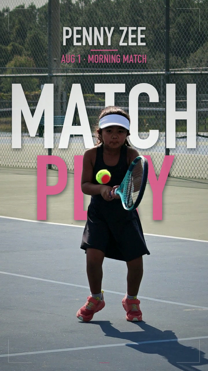Penny Zee ready for a tennis point, with her racket and ball on an outdoor court