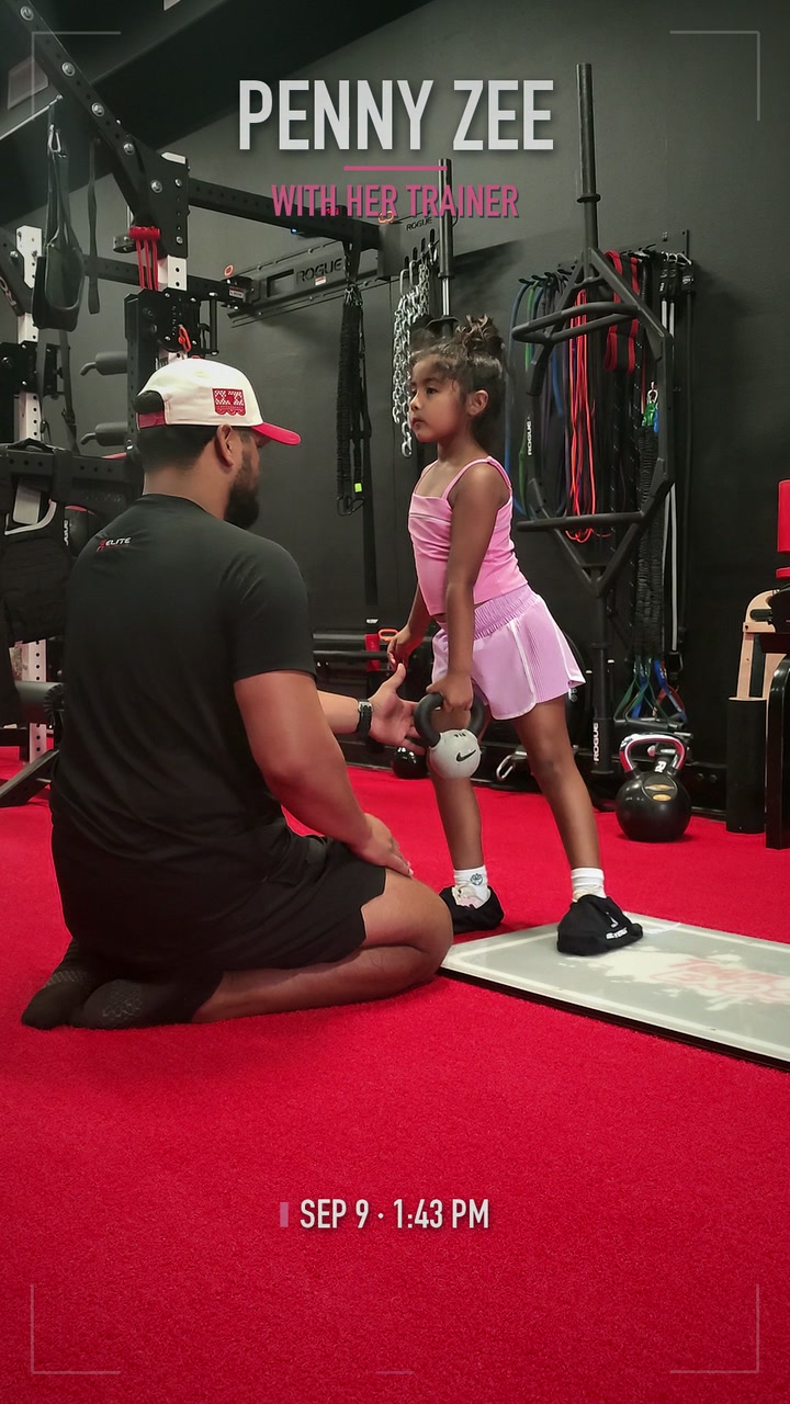 Penny working with her trainer in the gym